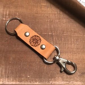 Handmade genuine leather keychain with laser engraved mandala.